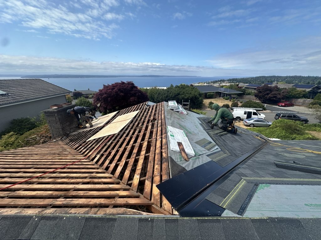 Roof deck replacement and underlayment installation in progress