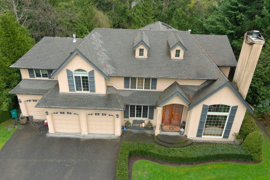 Worn asphalt shingle roof on residential home