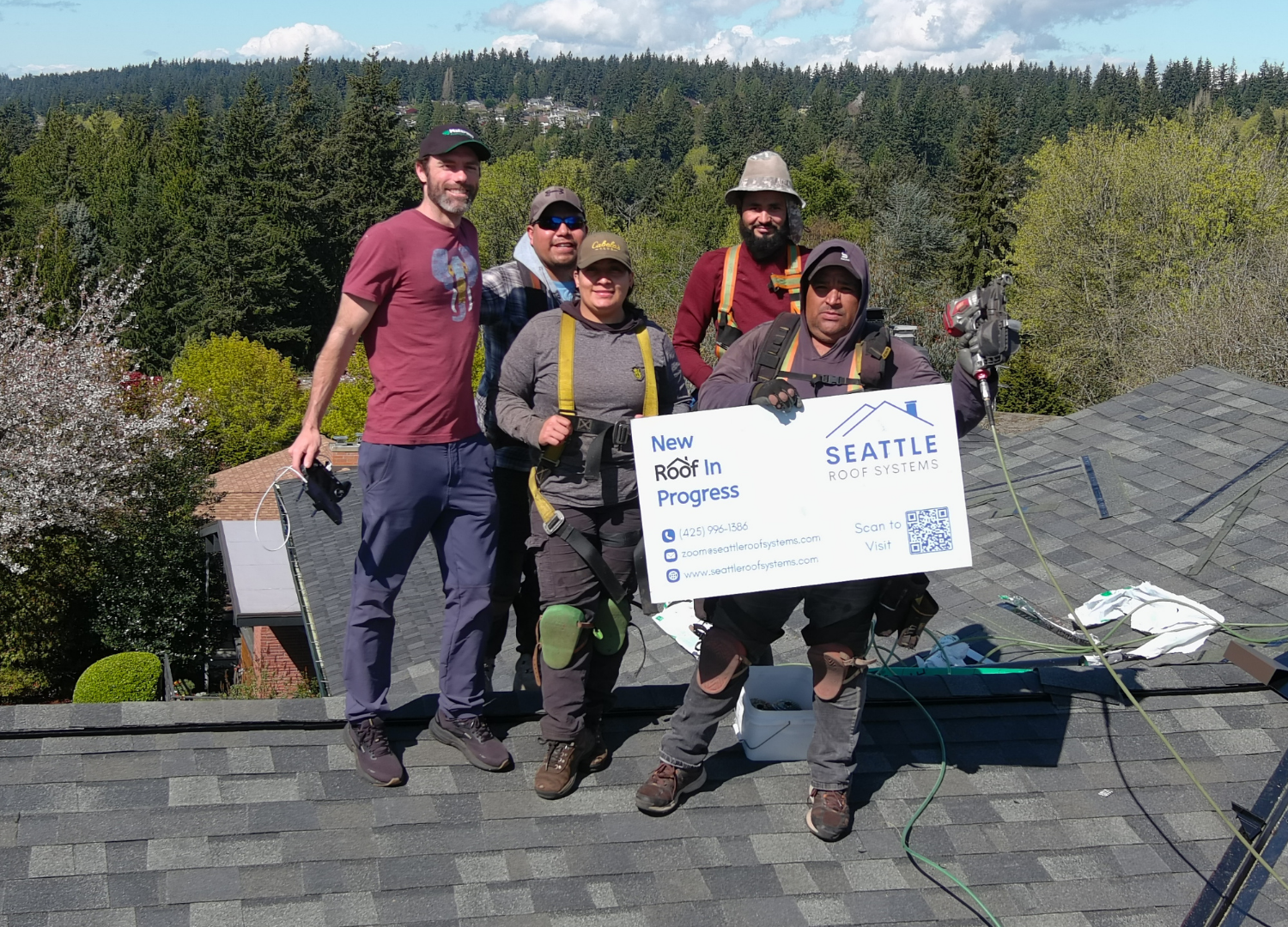 Seattle Roof Systems roofing crew standing together on a completed roof
