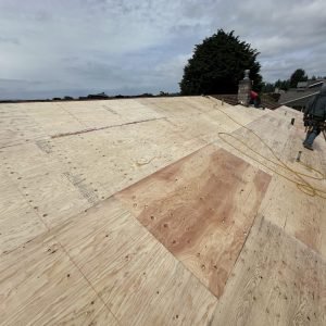 Roof decking installation progress with professional roofing team