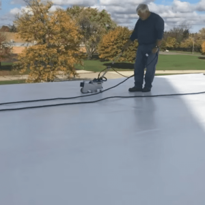TPO roofing installation in progress with heat-welding machine