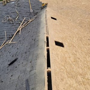 Roof replacement with old shingles removed